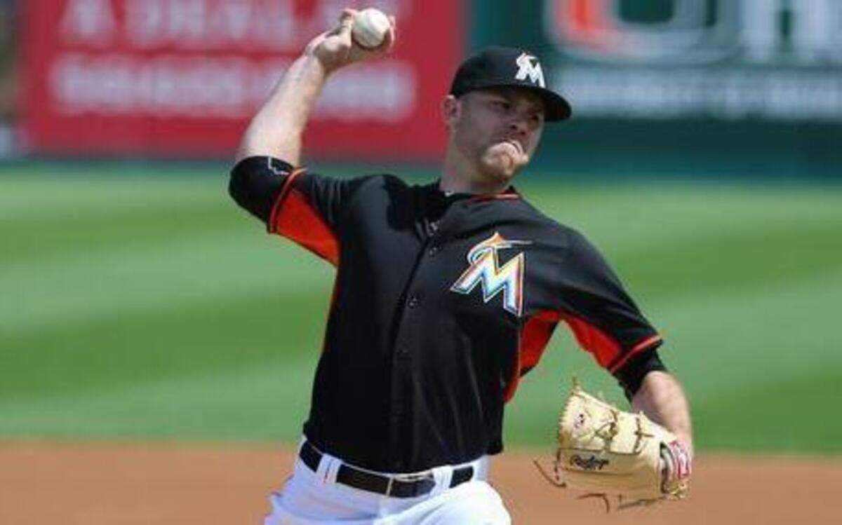 
David Phelps pitches for the Miami Marlins against the St. Louis Cardinals during a spring training game at Roger Dean Stadium in Jupiter on Thursday, March 5, 2015.
