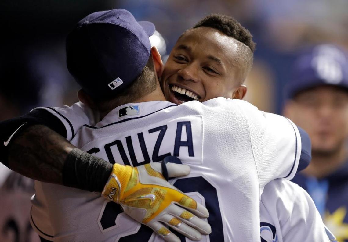 Tampa Bay Rays' Tim Beckham, right, hugs Steven Souza Jr. after Beckham hit a two-run home run off Miami Marlins' Dan Straily during the fourth inning of a baseball game Thurs., May 4, 2017, in St. Petersburg, Fla.