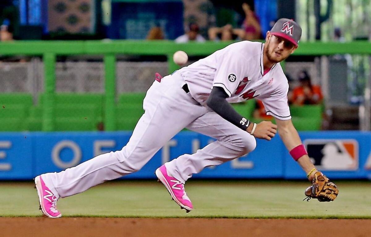 The Marlins' J.T. Riddle fields a grounder as the Miami Marlins beat the Atlanta Braves on Sunday, May 14, 2017.