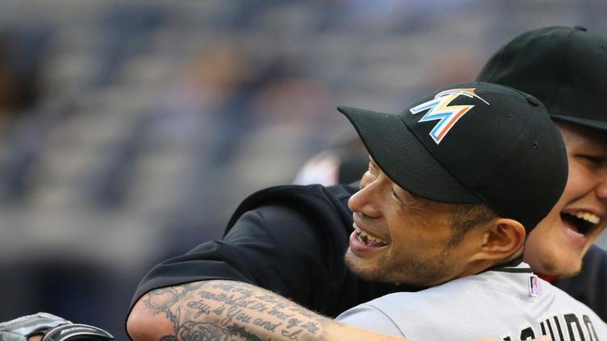 
Ichiro Suzuki #51 of the Miami Marlins hugs Mat Latos #35 of the Miami Marlins before their game against the New York Yankees at Yankee Stadium on June 17, 2015 in New York City. 
