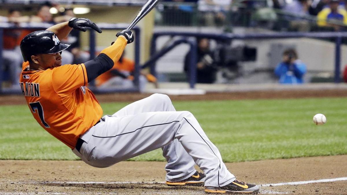 
In this photo taken on Thursday, Sept. 11, 2014, Miami Marlins' Giancarlo Stanton falls back after he was hit by a pitch during the fifth inning of a baseball game against the Milwaukee Brewers in Milwaukee. 
