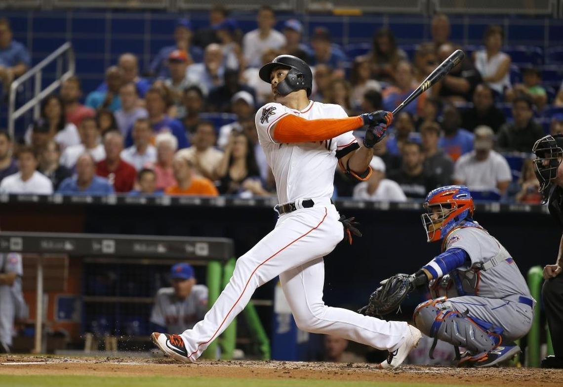 Miami Marlins right fielder Giancarlo Stanton hits a solo home run against the New York Mets at Marlins Park in Miami on June 29, 2017.