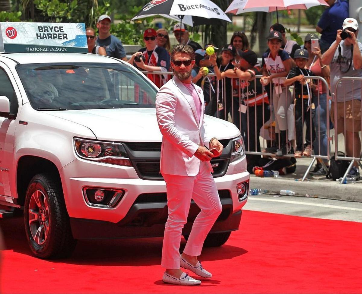 MLB player Bryce Harper, of the Nationals, hits the red carpet in Miami fashion as fans lined-up the parade route during the MLB's "All Star Red Carpet Show 2017" parade on Tues., July 11, 2017.