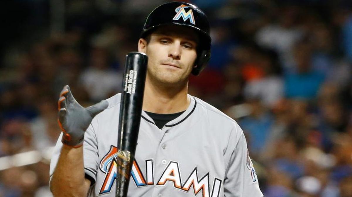 Miami Marlins' Jake Esch heads to the dugout after striking out during the second inning of a baseball game against the New York Mets, Wed., Aug. 31, 2016, in New York.