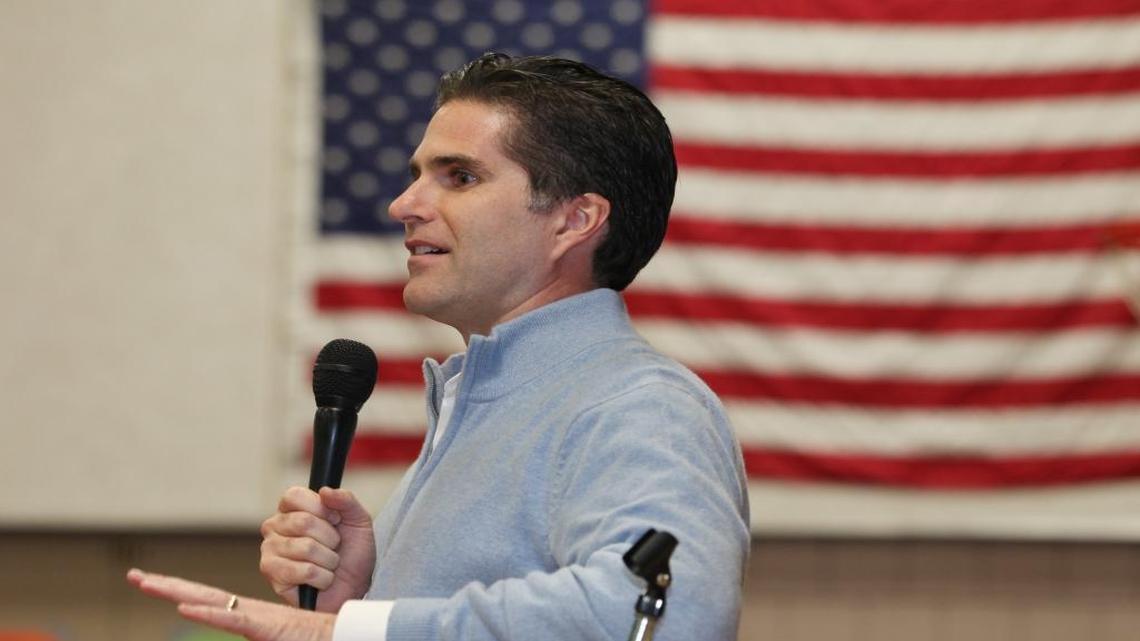 Tagg Romney speaks on behalf of his father, Republican presidential candidate Mitt Romney, during the Kennebec County Super Caucus in Augusta, Maine on Saturday, Feb. 4, 2012.