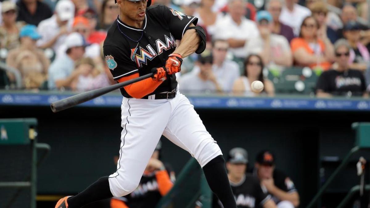 Miami Marlins’ Giancarlo Stanton missed Monday’s exhibition game against the Washington Nationals with a sore knee.