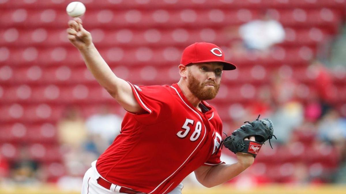 Cincinnati Reds starting pitcher Dan Straily, seen here throwing during the first inning of a baseball game against the Texas Rangers on Aug. 23, 2016, in Cincinnati, has reportedly been traded to the Miami Marlins. (AP Photo/John Minchillo)
