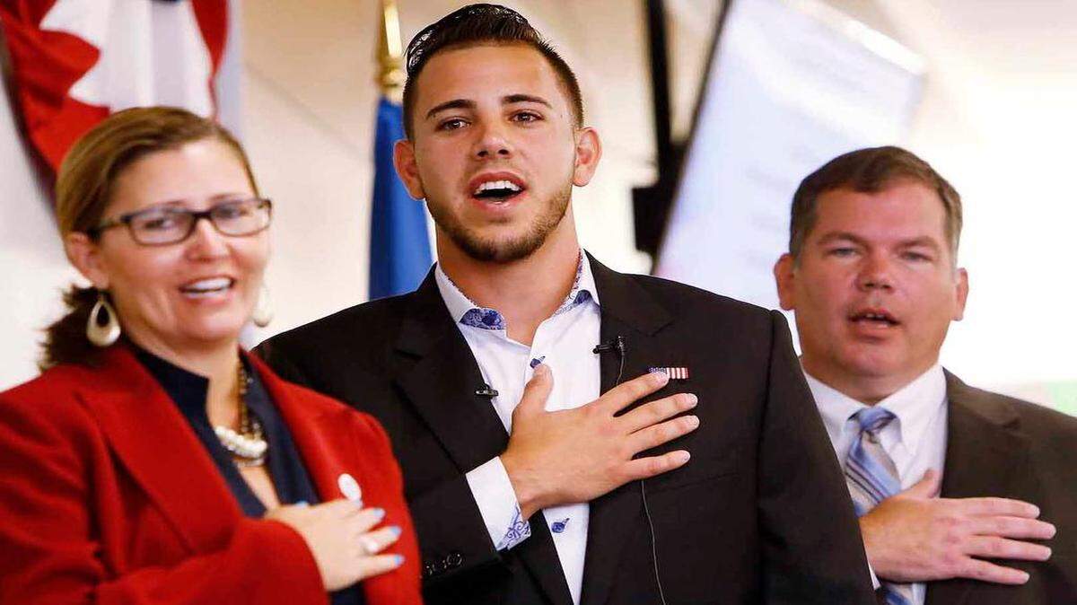 
Marlins pitcher Jose Fernandez ditched his team colors Friday for the red, white and blue of his adopted nation. The 22-year-old joined 140 other South Florida residents in becoming U.S. citizens.
