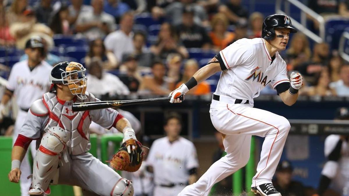 Miami Marlins second baseman Derek Dietrich hits a single during the third inning of the game against the Washington Nationals on Fri., May 20, 2016 at Marlins Park in Miami.