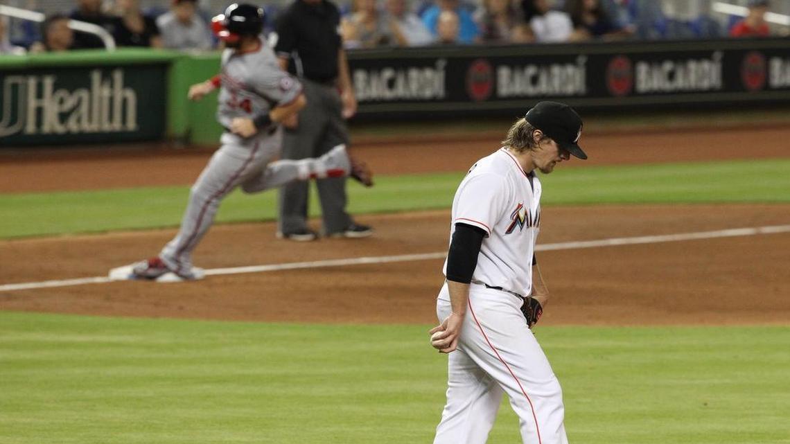 
Bryce Harper of the Washington Nationals rounds the bases after hitting a three-run home run in the fifth inning off Tom Koehler (foreground) of the Miami Marlins on Wednesday, July 29, 2015 at Marlins Park in Miami.


