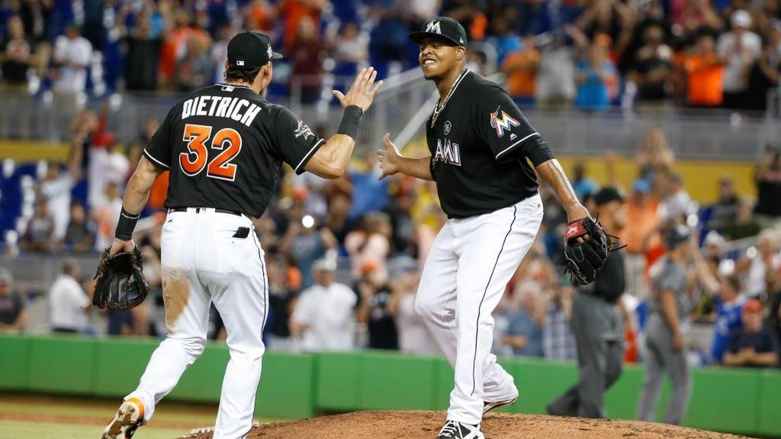 Miami Marlins pitcher Edinson Volquez, right, celebrates with Derek Dietrich (32) after throwing a no-hitter as the Marlins defeated the Arizona Diamondbacks 3-0 on Saturday.