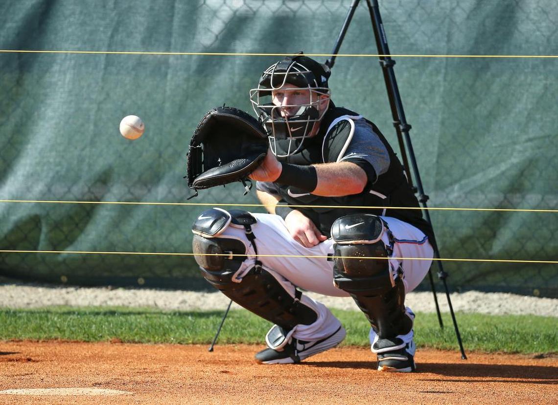 Miami Marlins catcher Chad Wallach (17) eyes on the baseball during practice before the start of a Major League Baseball spring training game against the New York Mets at the Roger Dean Chevrolet Stadium on Tuesday, March 5, 2019 in Jupiter, FL.