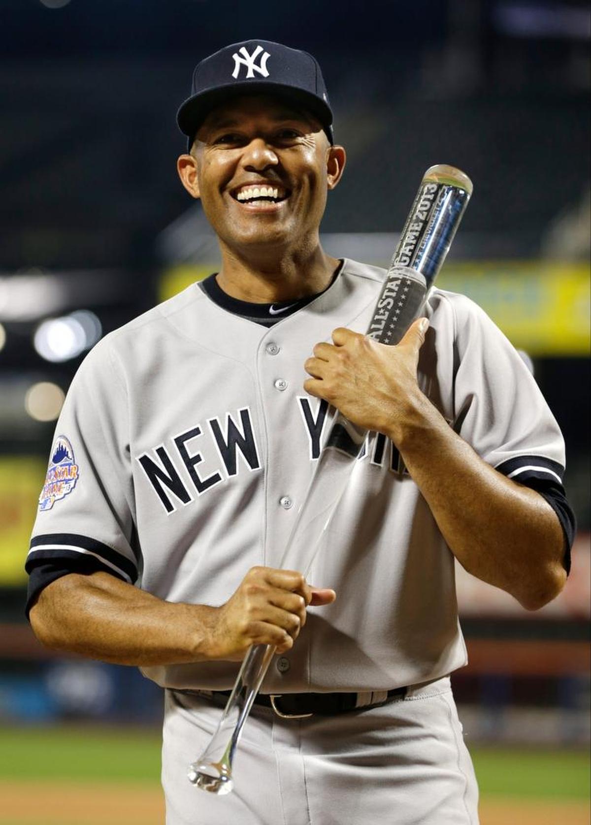 American League’s Mariano Rivera, of the New York Yankees, poses with the MVP trophy after the MLB All-Star baseball game, on Tuesday, July 16, 2013, in New York. The American League defeated the National League 3-0.