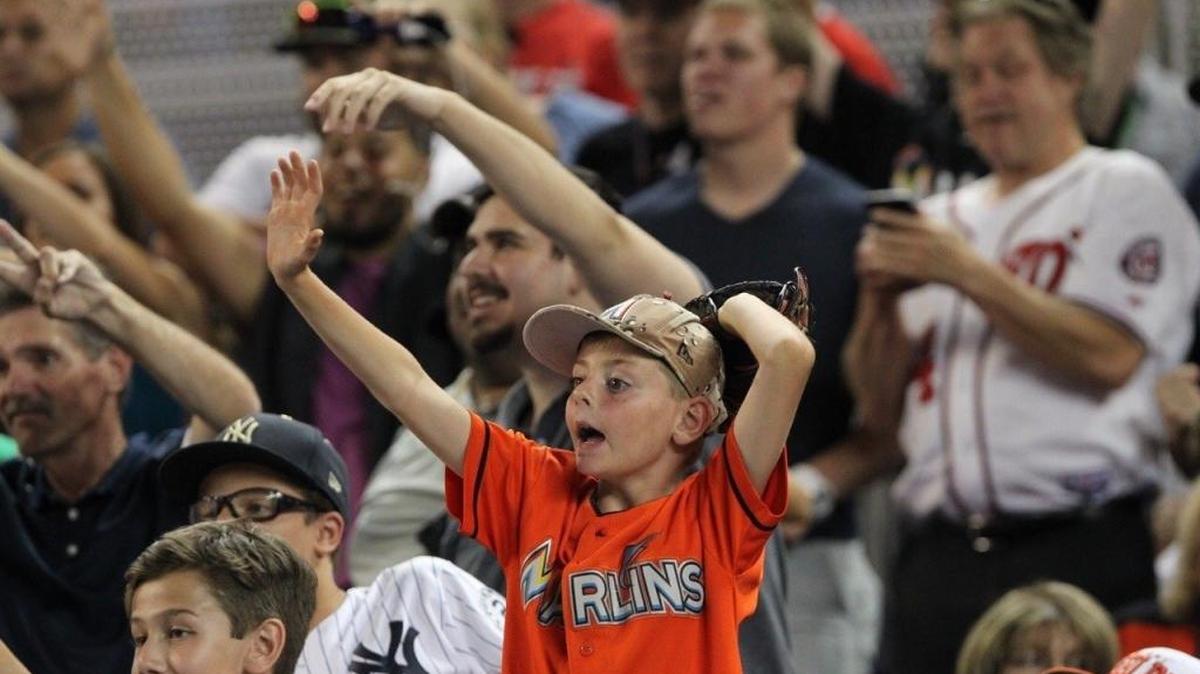 Fans showing their support during the MLB baseball All-Star Home Run Derby on Monday at Marlins Park in Miami.