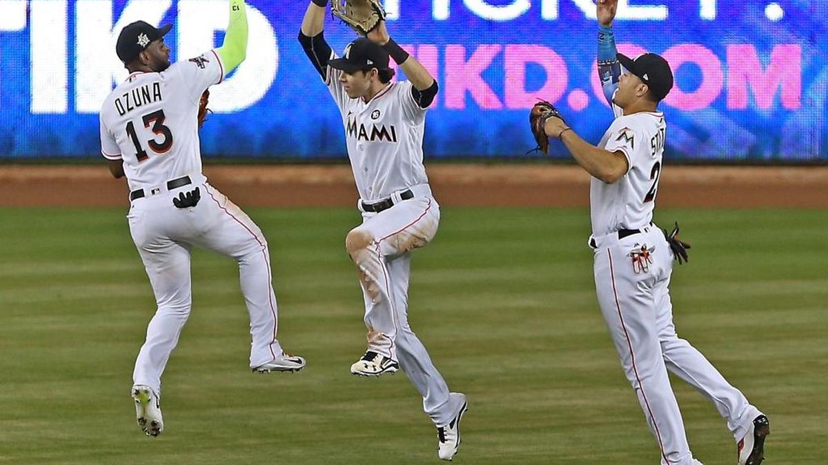 The Marlins have traded Marcell Ozuna (left) and Giancarlo Stanton (right), leaving only Christian Yelich as the only remaining member of one of the best outfields in the majors.
