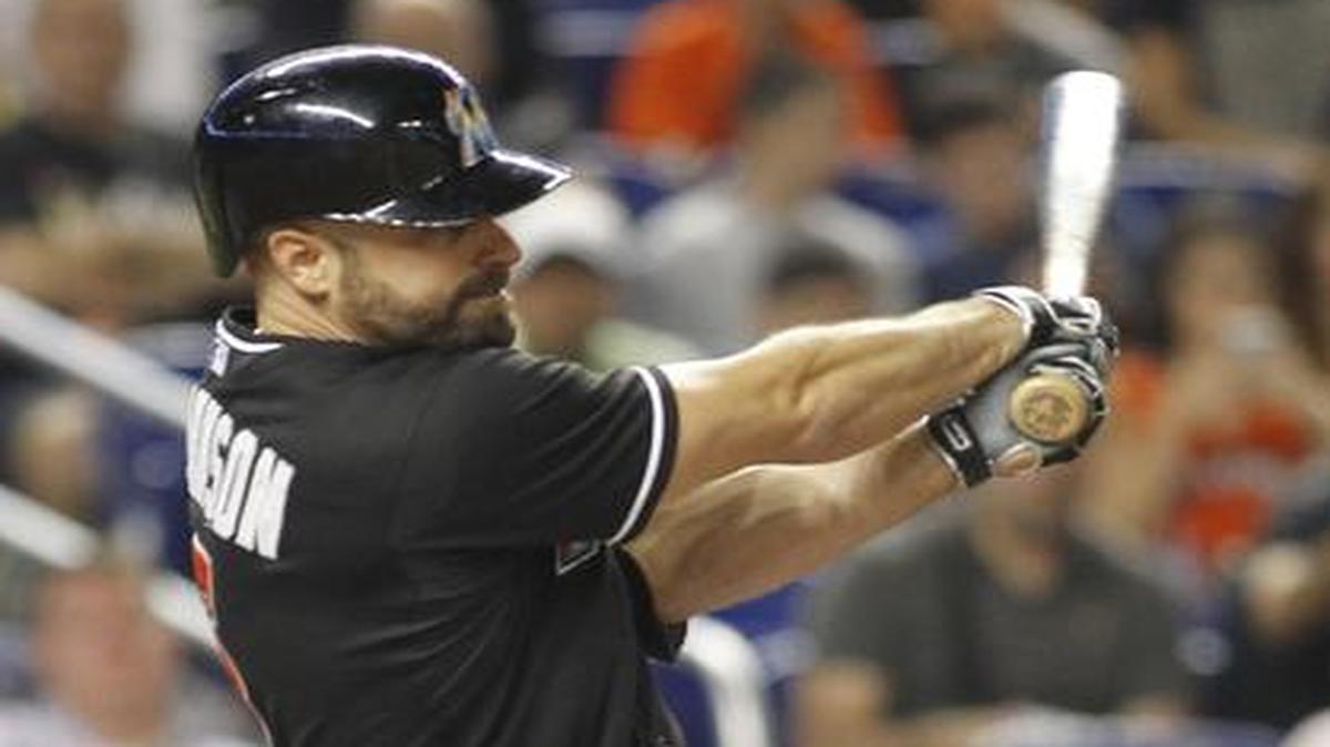 
Solid swing: The Marlins’ Reed Johnson hits a double in the fourth inning of the Nationals’ 3-2 victory on Saturday night at Marlins Park. 
