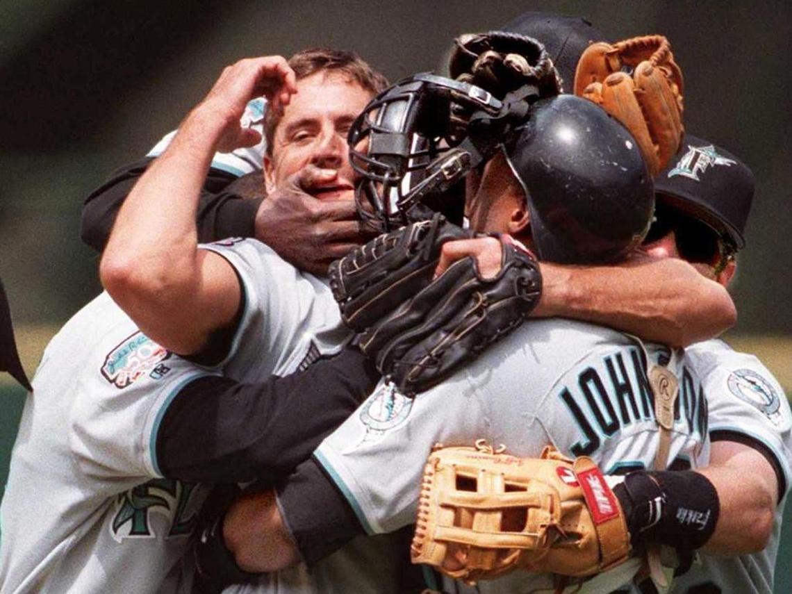 Teammates mob Florida Marlins' pitcher Kevin Brown after the last out of his no-hitter against the San Francisco Giants on June 10, 1997.