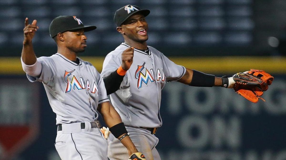 
Marlins Dee Gordon, left, and Adeiny Hechavarria celebrate a 4-0 victory over the Braves in a baseball game at Turner Field on Monday, Aug. 31, 2015, in Atlanta, Ga. 
