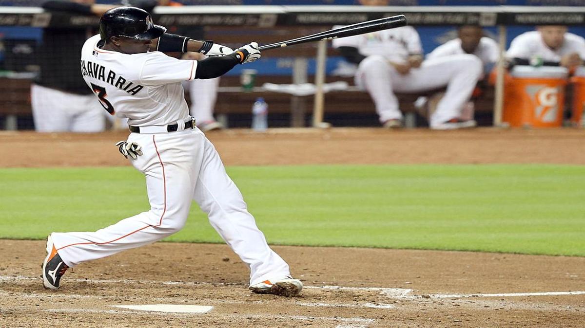 
Miami Marlins Adeiny Echevarria singles in the fifth inning against the Washington National at Marlins Park on Friday, Abril 24, 2015.
