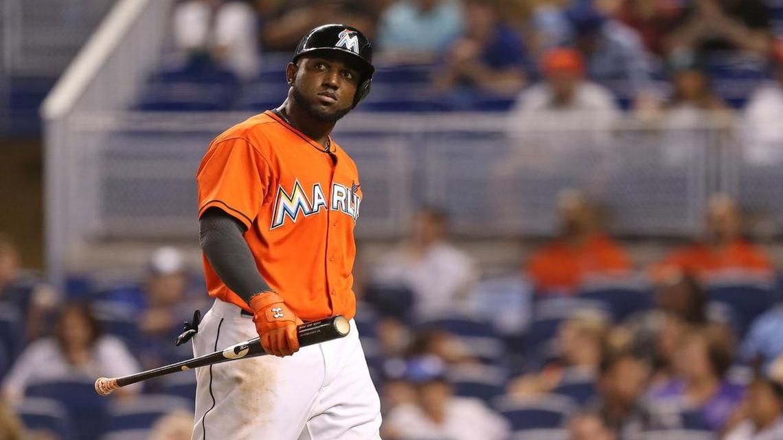 
MIAMI, FL - JUNE 28: Marcell Ozuna #13 of the Miami Marlins reacts after striking out during the ninth inning of the game against the Los Angeles Dodgers at Marlins Park on June 28, 2015 in Miami, Florida. 

