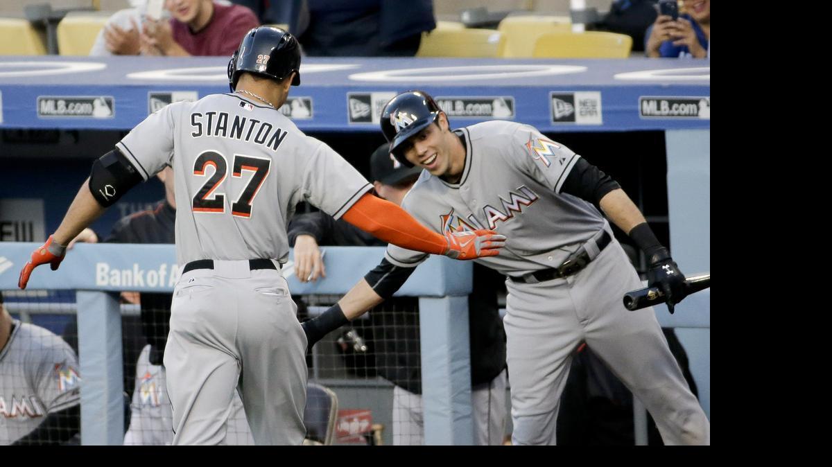 
Miami Marlins' Giancarlo Stanton celebrates after his home run with Christian Yelich during first inning of a baseball game against the Los Angeles Dodgers in Los Angeles, Tuesday, May 12, 2015.
