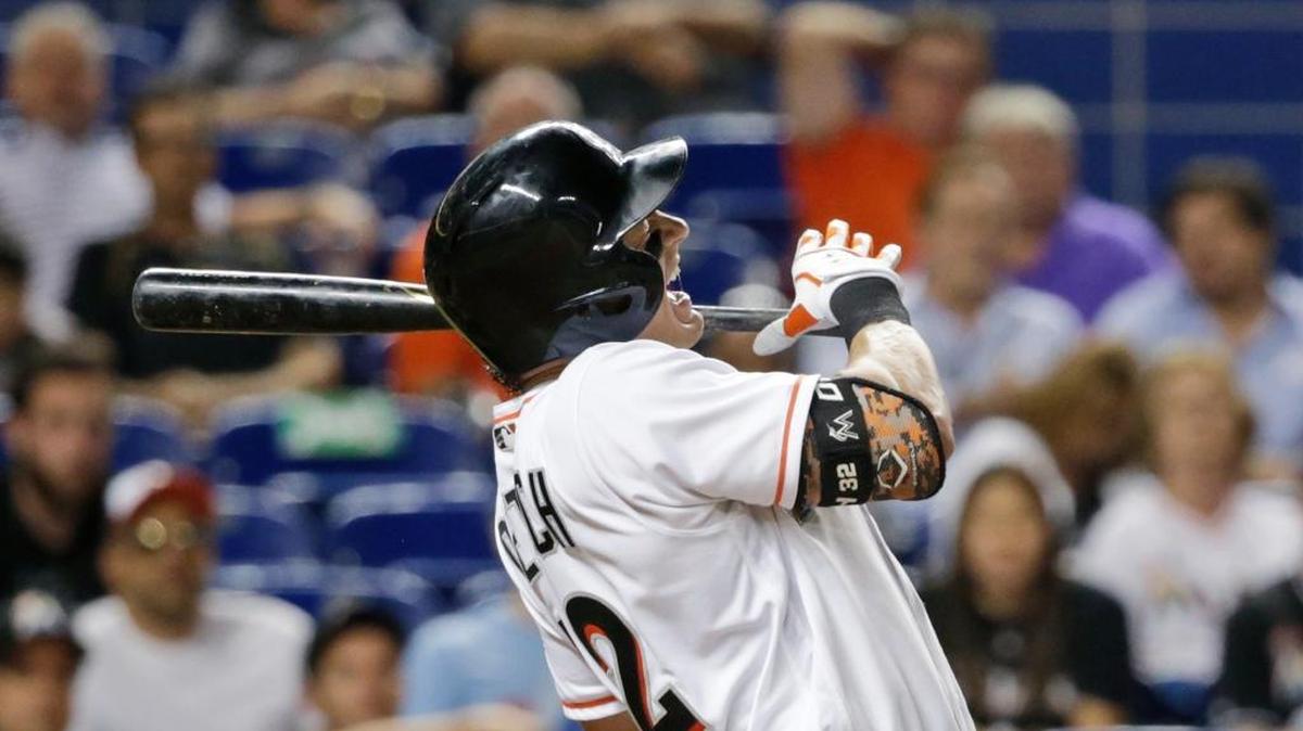 Miami Marlins' Derek Dietrich reacts as he is hit by a pitch during the eighth inning of a baseball game against the Pittsburgh Pirates, Wed., June 1, 2016, in Miami. The Marlins defeated the Pirates 3-2.