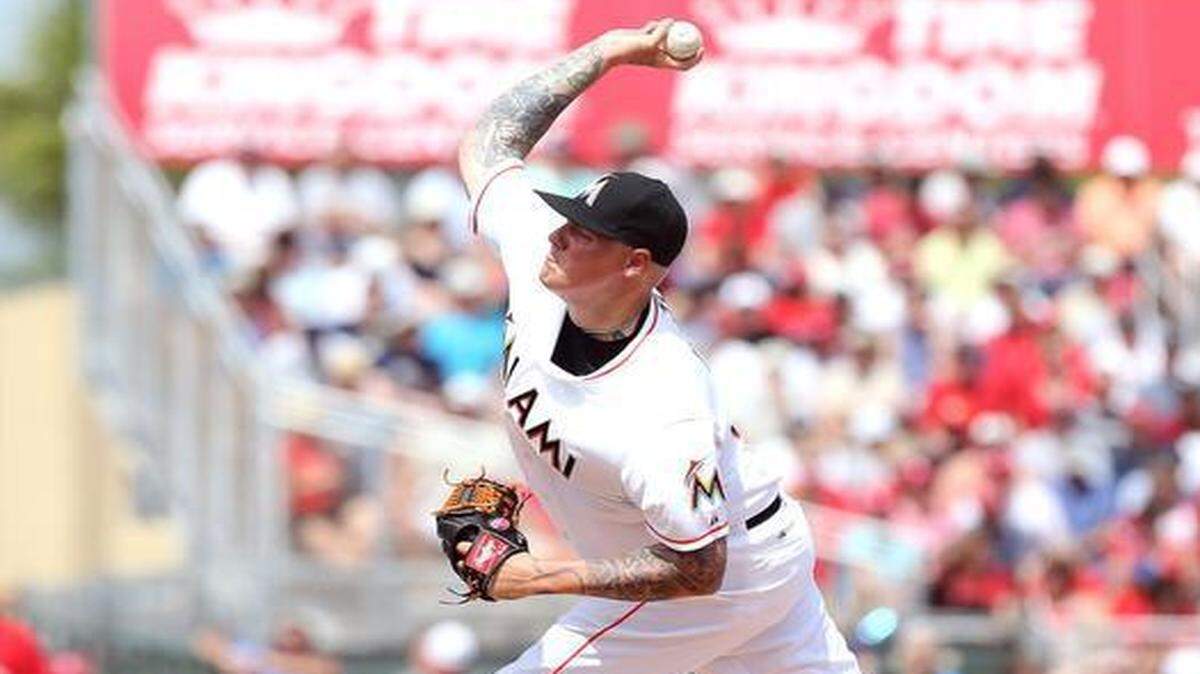
Miami Marlins pitcher Mat Latos pitches against the St. Louis Cardinals during the second inning of their Spring Training game at Roger Dean Stadium in Jupiter on Friday, March 13, 2015.
