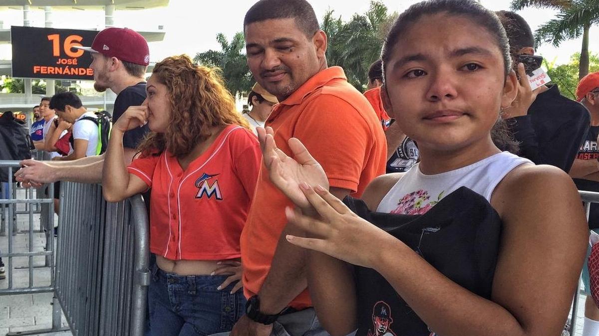 Jose Fernandez fan Kelsi Figueroa, 12, fights back tears upon hearing of her sports hero's death. She like many other Marlins fans gathered early to receive commutative bats. Miami Marlins star pitcher, Jose Fernandez, who died last night during a boating accident, is remembered with his number displayed outside Marlins Park on Sun., Sept. 25, 2016. Today's game has been cancelled.