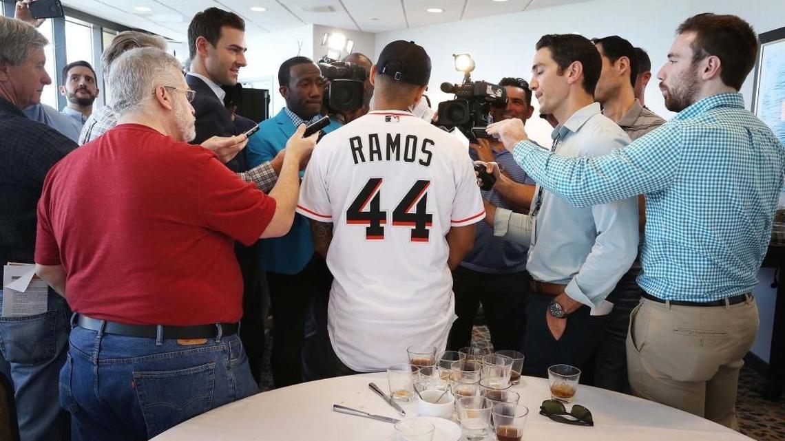 Marlins closer A.J. Ramos takes questions from a large media gathering during the team’s media luncheon on Friday.