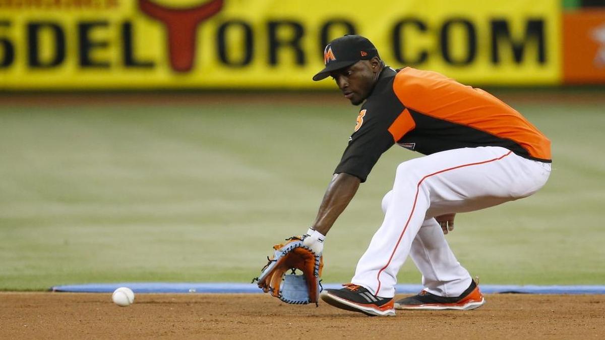 Miami Marlins shortstop Adeiny Hechavarria fielding a ground ball during practice before the start of a baseball game against the Oakland Athletics at Marlins Park on Tues., June 13, 2017 in Miami.