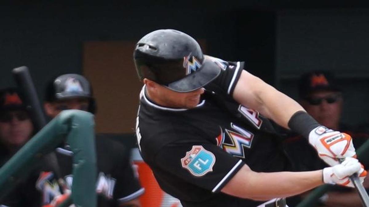 Miami Marlins third baseman Chris Johnson singles in the seventh inning during a spring training game against the New York Yankees at Roger Dean Stadium in Jupiter on March 8, 2016.