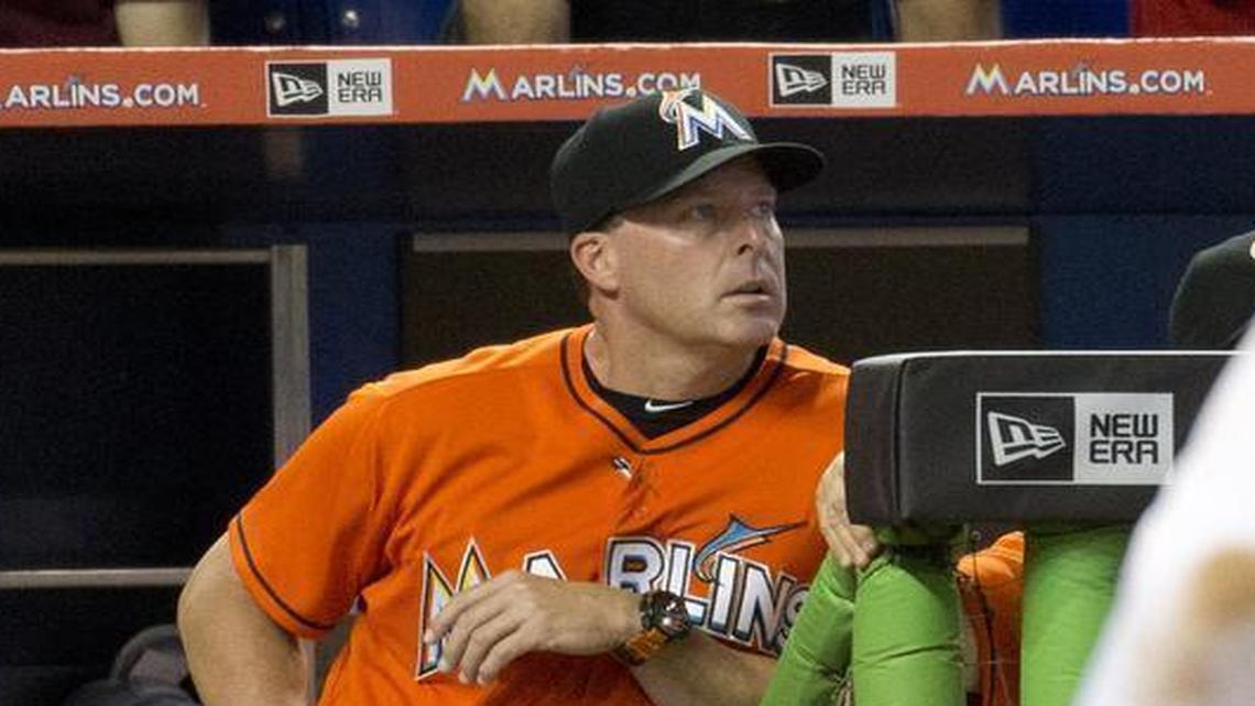
Miami Marlins manager Mike Redmond stands in the dugout during the ninth inning of a baseball game against the Atlanta Braves in Miami, Sunday, May 17, 2015. The Braves won 6-0. Redmond was fired Sunday as manager of the Marlins, moments after they were nearly no-hit in a loss that completed a three-game sweep. 
