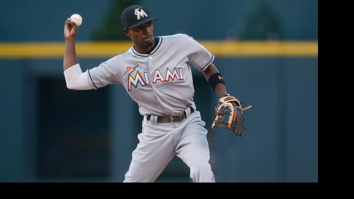 
Miami Marlins second baseman Dee Gordon throws to first base to put out Colorado Rockies' Charlie Blackmon in the first inning Friday, June 5, 2015, in Denver.

