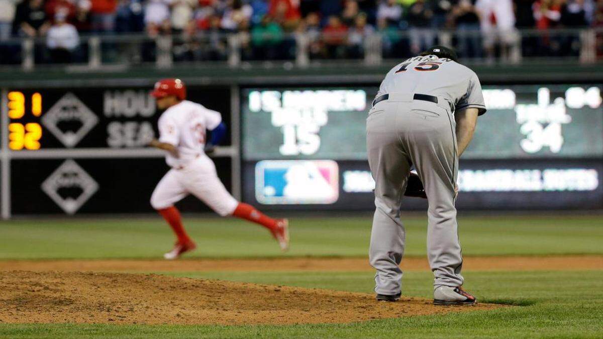 
Marlins pitcher Dan Haren slumps on the mound after giving up a two-run homer to Freddy Galvis in the second inning of Tuesday’s game.
