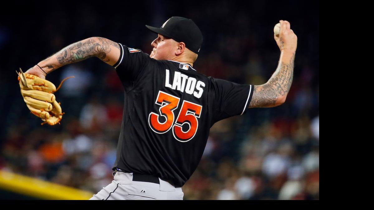 
Mat Latos shrugged off trade rumors and pitched seven scoreless innings against the Diamondbacks on Tuesday, July 21, 2015, in Phoenix. “I owe it to the other 24 guys in this clubhouse to give 110 percent until they kick me out of the clubhouse,” he said.
