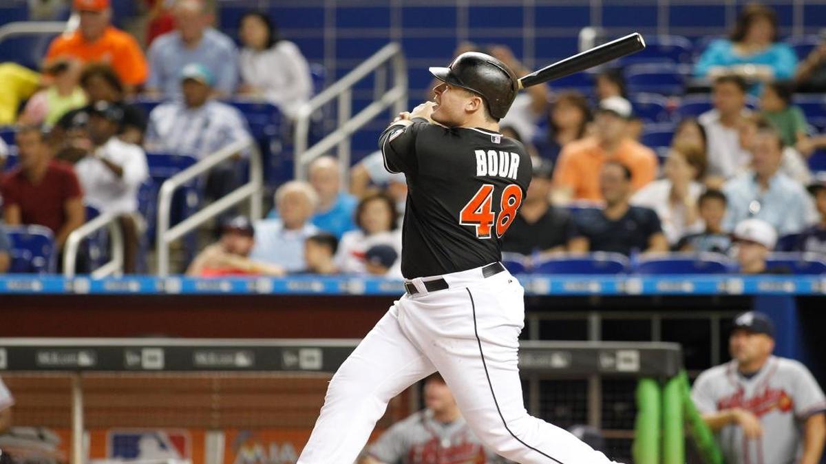 
Miami Marlins first baseman Justin Bour hits a first inning home run against the Atlanta Braves during a baseball game in Miami, Saturday Sept. 26, 2015.
