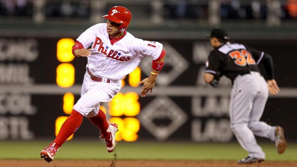 Philadelphia Phillies' Cesar Hernandez (16) rounds second base to score on a hit by Tommy Joseph in the sixth inning of a baseball game against the Miami Marlins, Tues., May 17, 2016, in Philadelphia. The Phillies won 3-1.