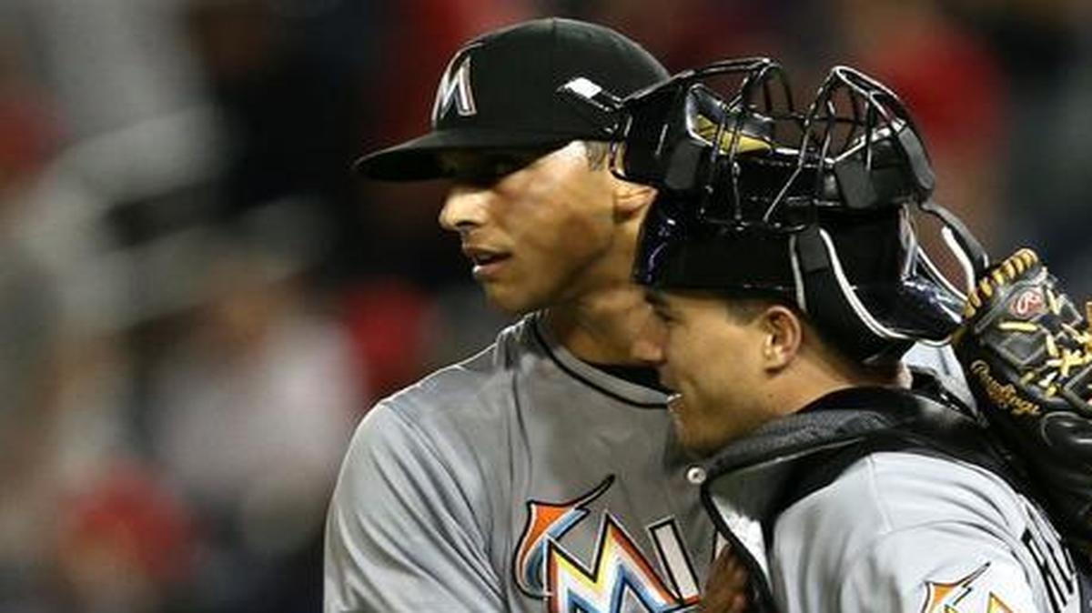 
Pitcher Steve Cishek celebrates with catcher J.T. Realmuto of the Miami Marlins after defeating the Washington Nationals at Nationals Park on May 5, 2015 in Washington, DC. The Miami Marlins won 2-1.
