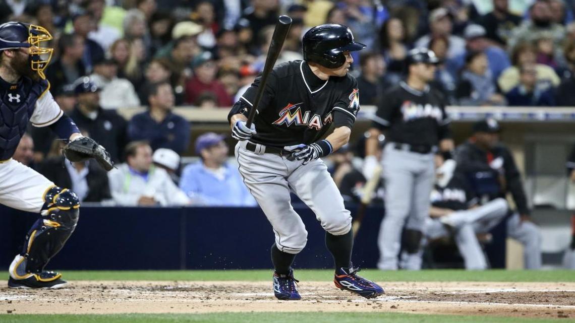 Ichiro Suzuki watches his line drive fall in for one of two base hits in the third inning Monday as the Marlins routed San Diego.