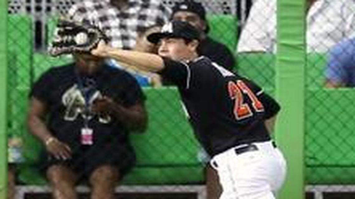 
Marlins outfielder Christian Yelich makes a catch to end the inning against the Pittsburgh Pirates in Miami on Friday, July 26, 2013.
