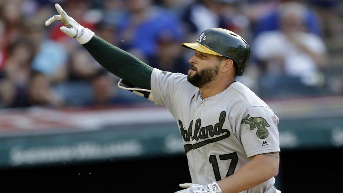 Oakland Athletics first baseman Yonder Alonso points to the sky after hitting a solo home run off Cleveland Indians starting pitcher Carlos Carrasco in the seventh inning of a baseball game, Mon., May 29, 2017, in Cleveland.