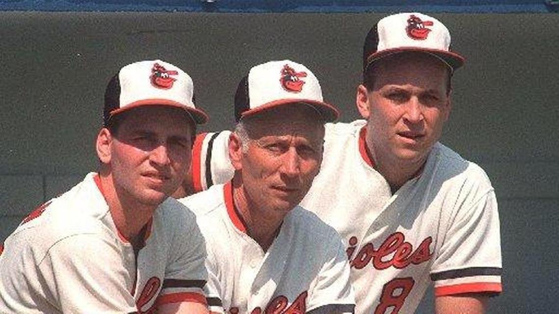 Cal Ripken Sr., center, is flanked by son Billy, left, and Cal Jr. at the Baltimore Orioles training camp in Miami 1987.