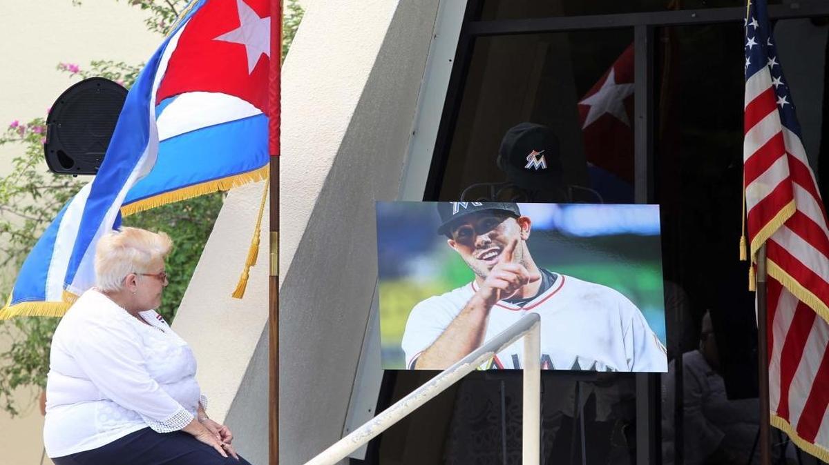 Sandy Tejeiro gazes at a portrait of Jose Fernandez at a memorial service at la Ermita de la Caridad on Sept. 28.