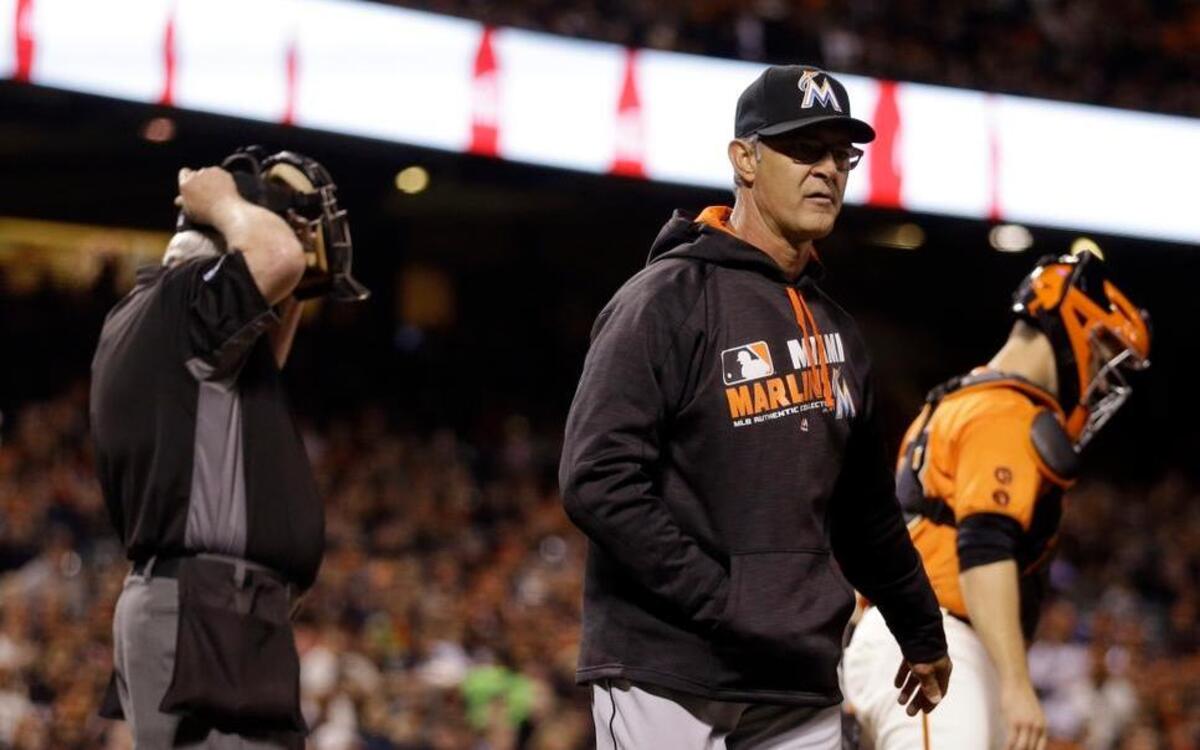 Miami Marlins manager Don Mattingly walks away from home plate umpire Mark Carlson after being ejected during the fourth inning of a baseball game against the San Francisco Giants on Friday, April 22, 2016, in San Francisco.