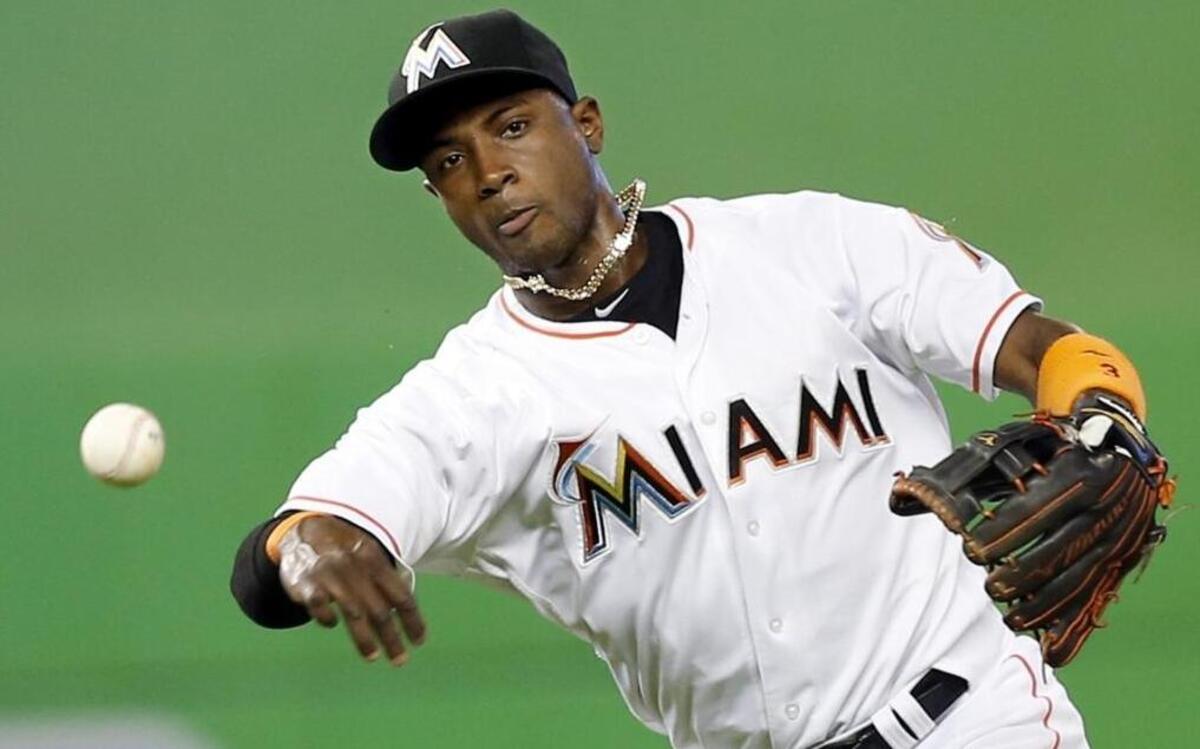 Miami Marlins shortstop Adeiny Hechavarria fields the ball in the first inning as the Miami Marlins host the Atlanta Braves at Marlins Park on Wed., June 22, 2016