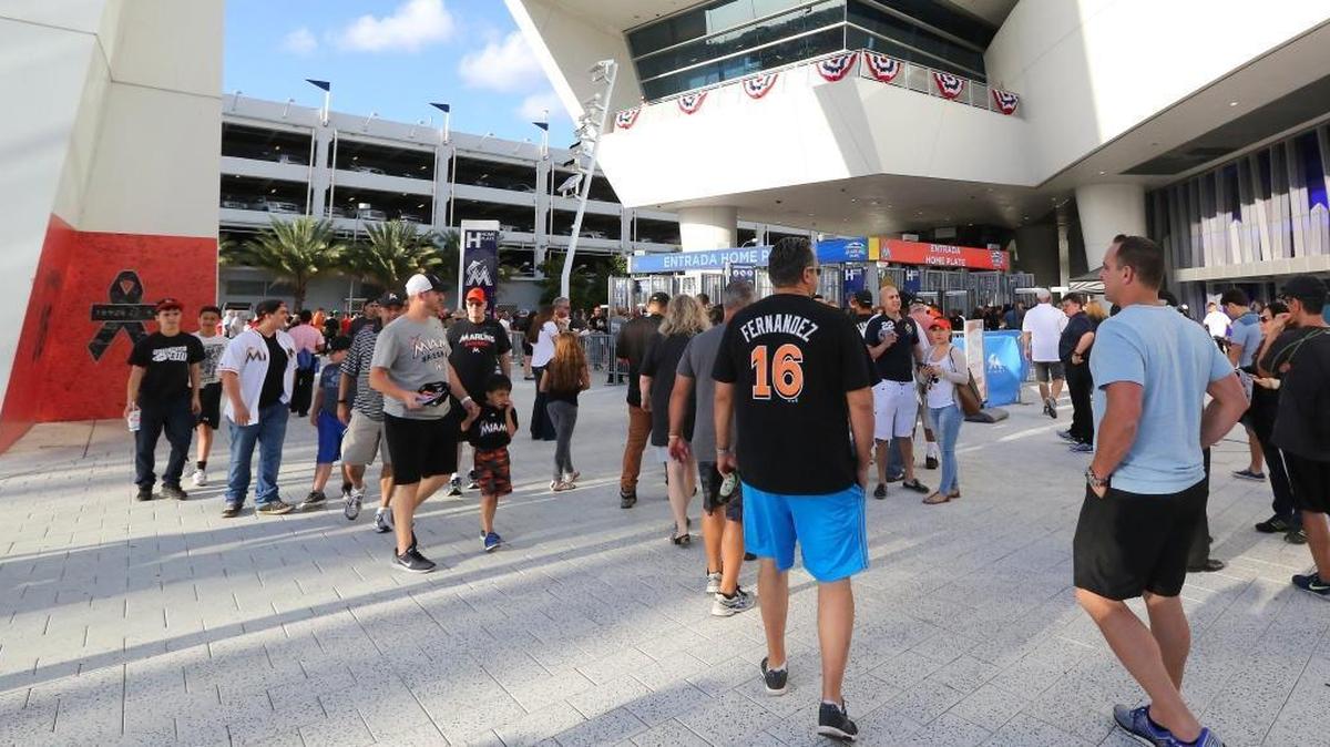 Fans line up outside before the start of the Miami Marlins’ home opener against the Atlanta Braves at Marlins Park on April 11, 2017, in Miami. The Marlins launched a new listening campaign, ‘Dímelo,’ which will allow fans the opportunity to have their voices heard on a variety of topics.