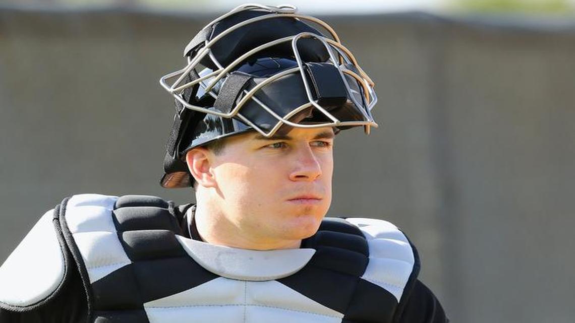 Miami Marlins catcher J.T. Realmuto looks on during spring training workouts at Roger Dean Stadium on Friday, February 19, 2016 in Jupiter, Florida.