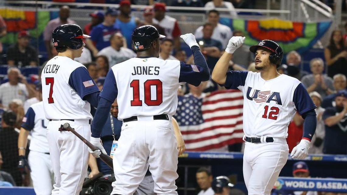 Nolan Arenado is congratulated by U.S. teammates Christian Yelich (7) and Adam Jones (10) after smacking a three-run homer that gave the Americans a 6-0 lead in the second inning in their Pool C win over Canada in the World Baseball Classic at Marlins Park.