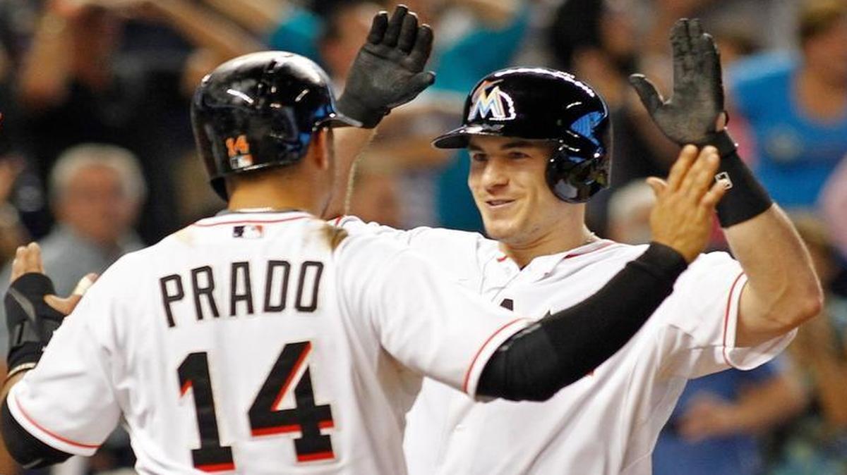 
J.T. Realmuto, right, of the Miami Marlins celebrates with teammates after his sixth-inning grand slam against the Boston Red Sox at Marlins Park on Aug. 12, 2015 in Miami, Florida.
