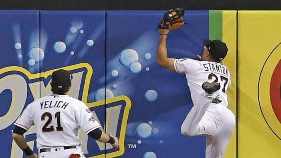 Miami Marlins right fielder Giancarlo Stanton makes a catch on a fly ball by Washington Nationals second baseman Daniel Murphy during the third inning at Marlins Park on Tuesday, September 5, 2017 in Miami.